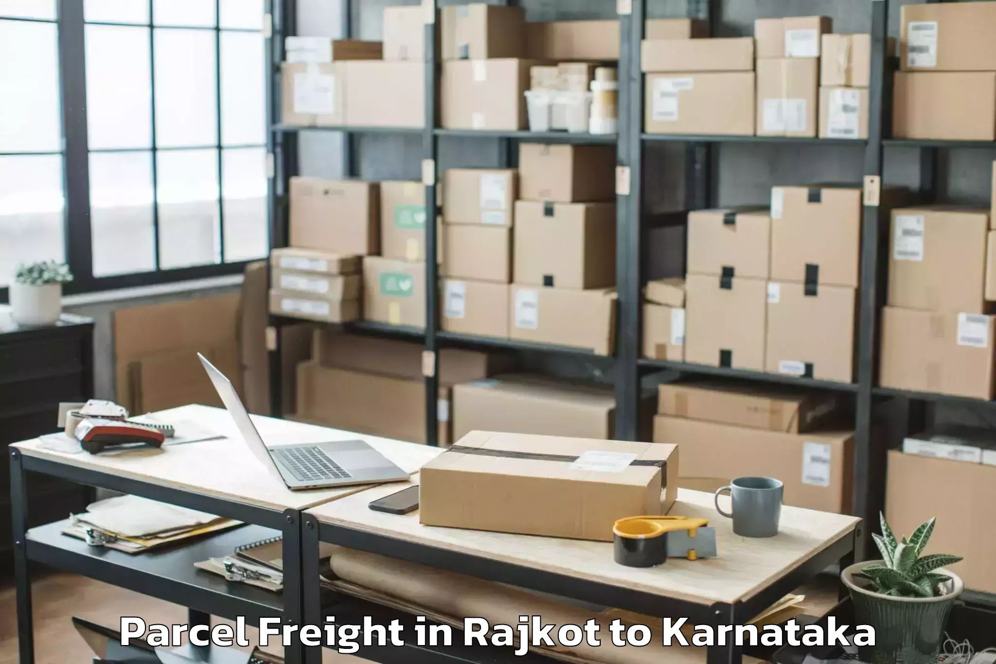 Top Rajkot to Karnataka Janapada Vishwavidya Parcel Freight Available